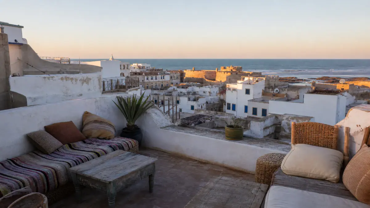 Riad rooftop terrace overlooking Essaouira medina and the Atlantic Ocean